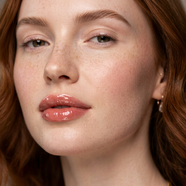 Close-up portrait of a model with glossy lips